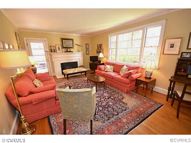 4411 Knob Road Richmond, VA 23235 - Photo 2 of 18 a living room with furniture a fireplace and a large window