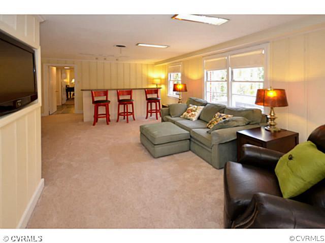 4411 Knob Road Richmond, VA 23235 - Photo 4 of 18 a living room with furniture and a flat screen tv