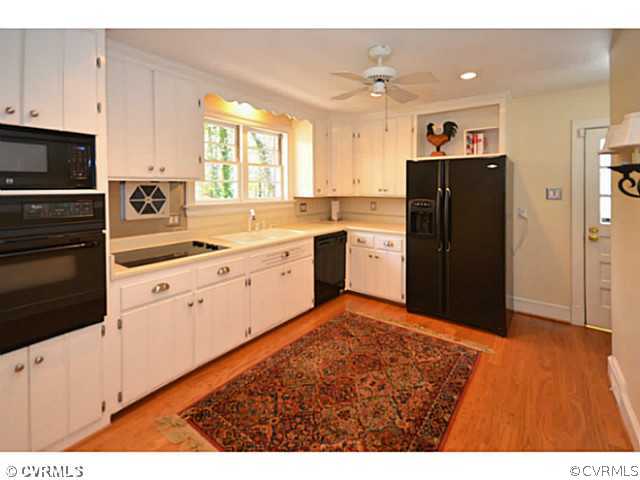 4411 Knob Road Richmond, VA 23235 - Photo 5 of 18 a kitchen with stainless steel appliances granite countertop a refrigerator and a stove top oven