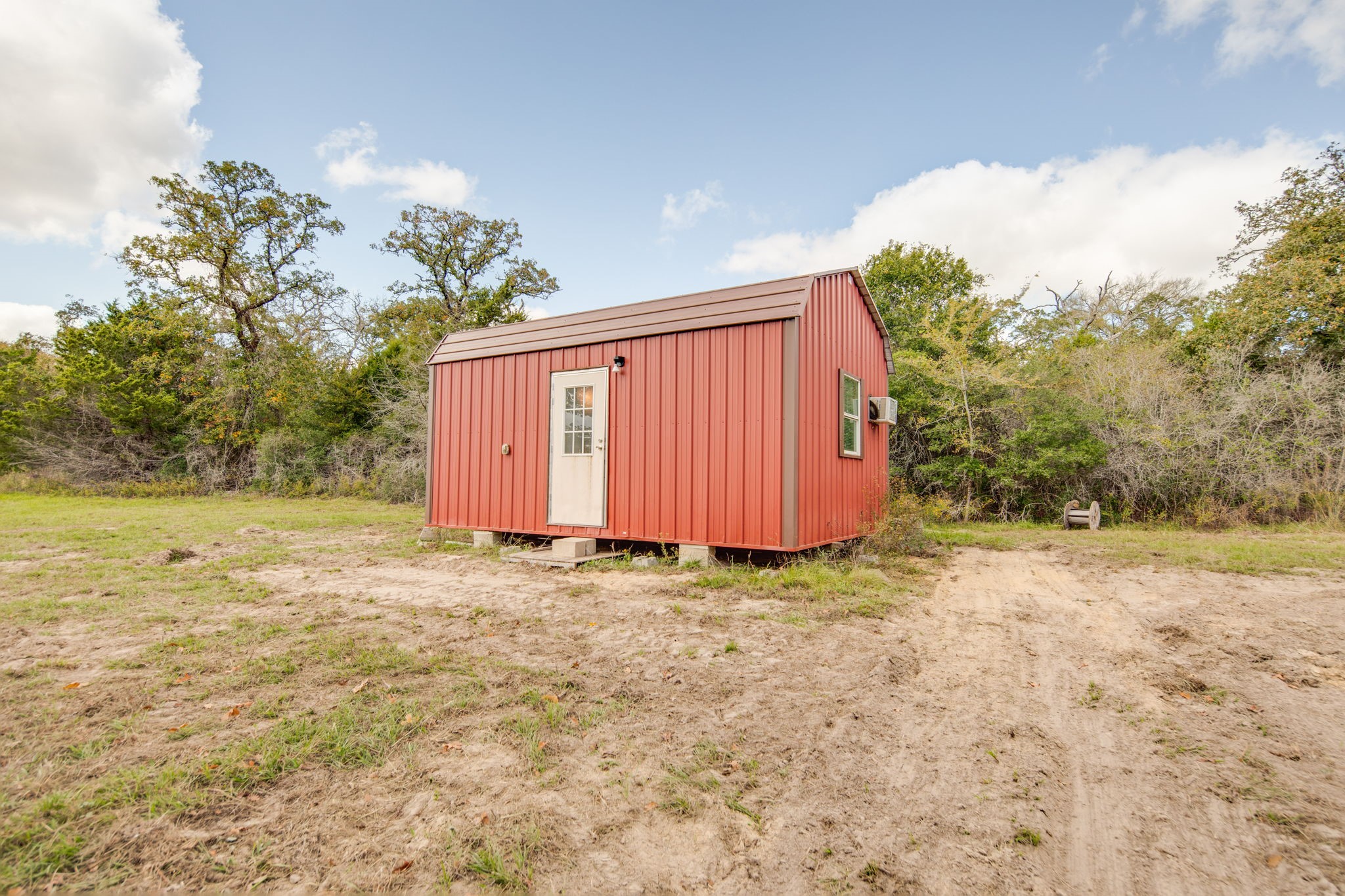 272 Pine Road Somerville, TX 77879 - Photo 12 of 22 a view of a backyard with large trees and wooden fence