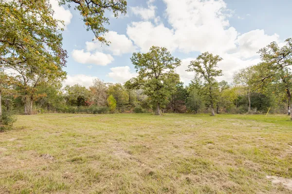 a view of a backyard of the house