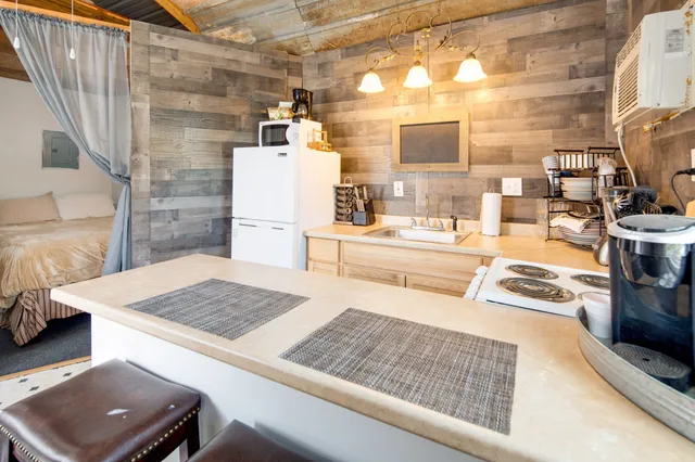 a kitchen with a sink stove and refrigerator