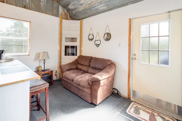 a living room with furniture and a window
