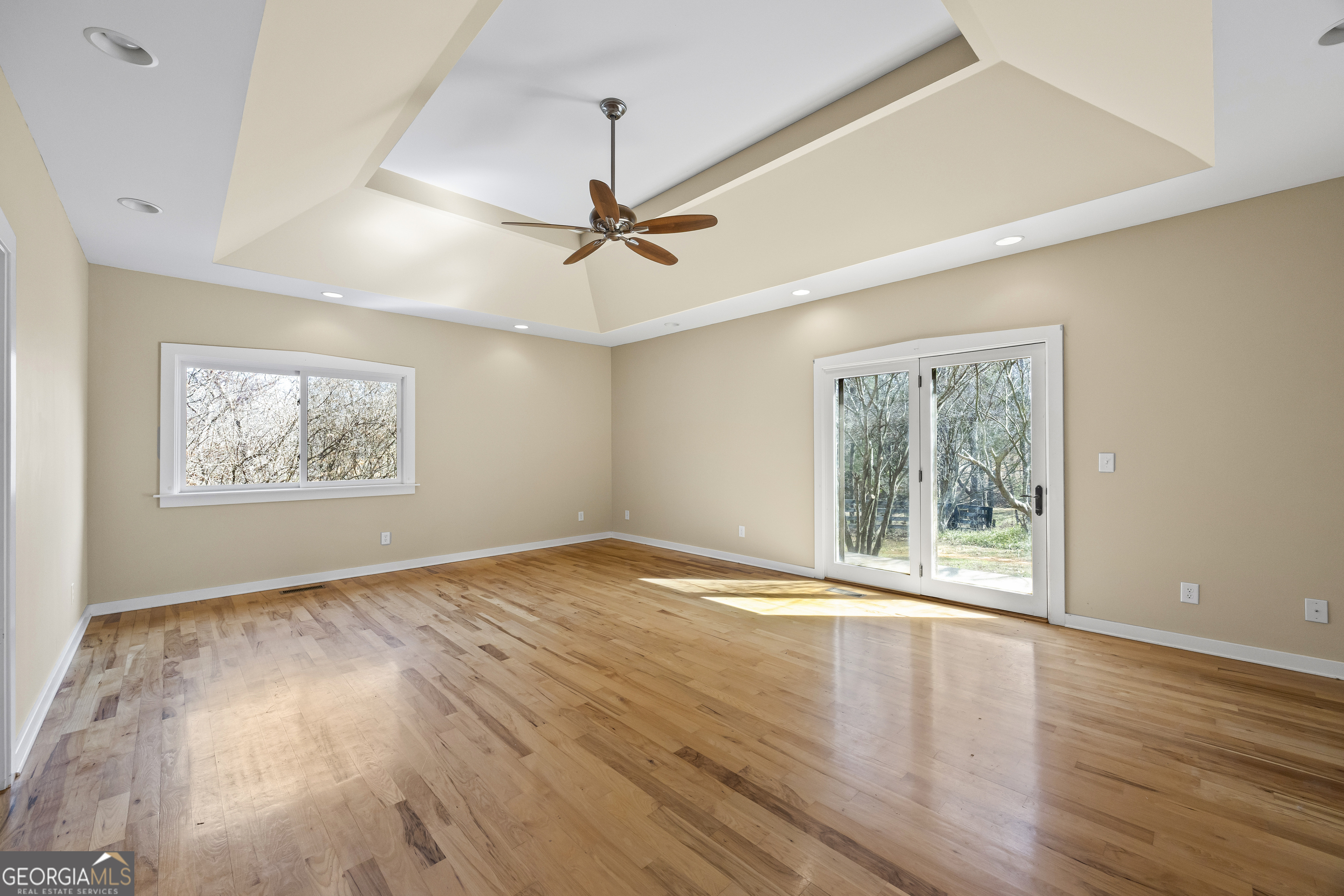 2223 Salem Road Watkinsville, GA 30677 - Photo 12 of 94 a view of an empty room with wooden floor and a window