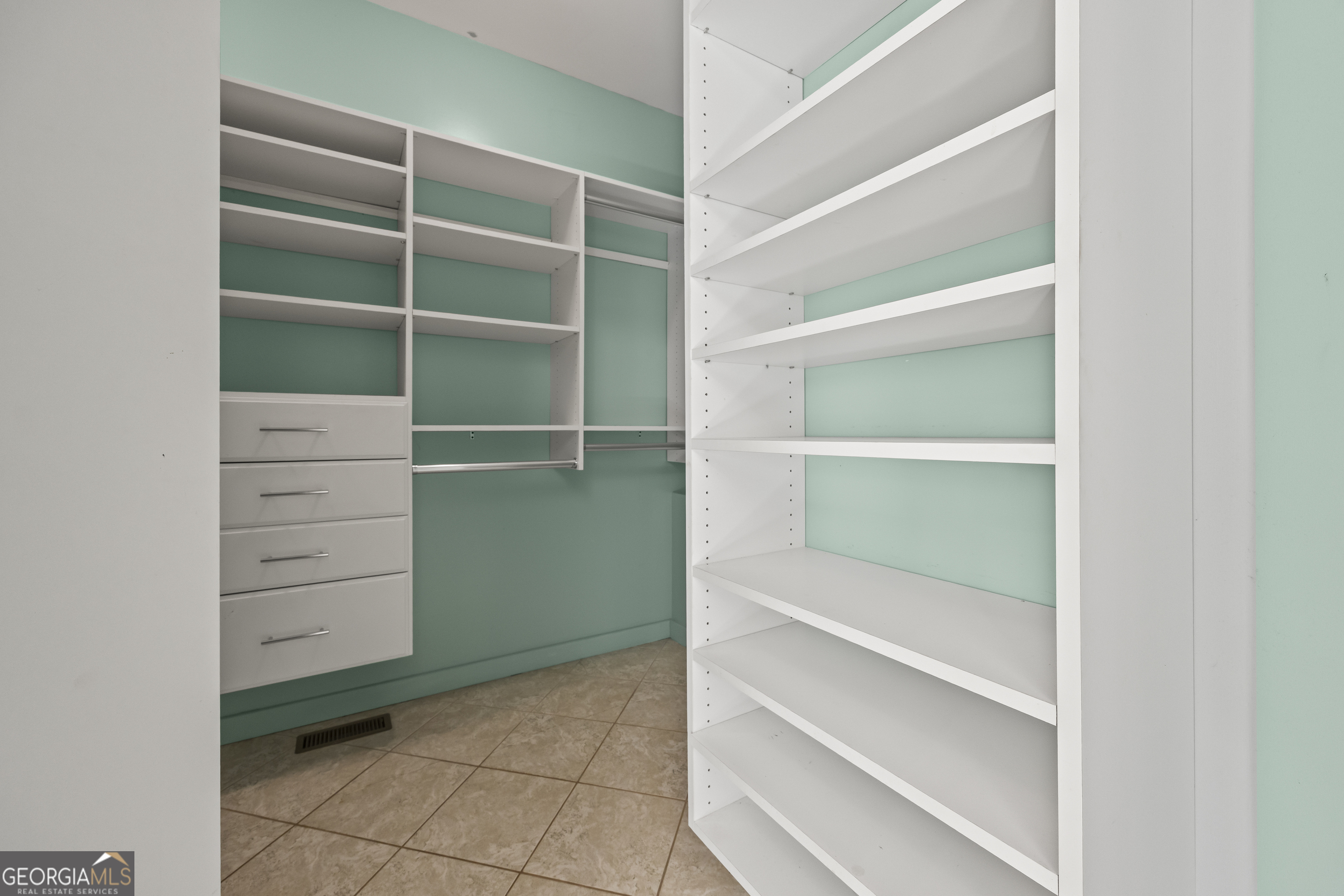 2223 Salem Road Watkinsville, GA 30677 - Photo 19 of 94 a view of walk in closet with empty racks