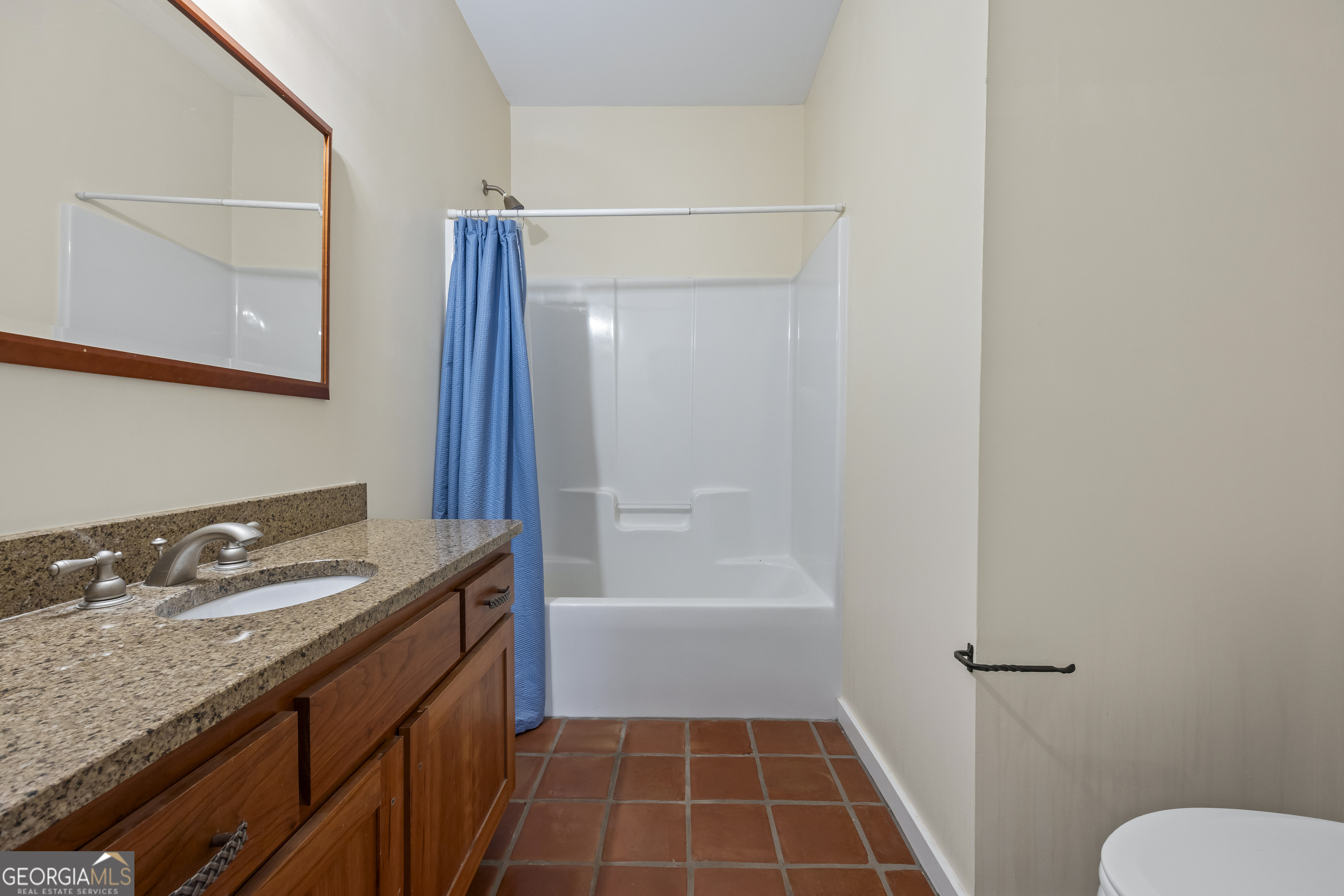 2223 Salem Road Watkinsville, GA 30677 - Photo 24 of 94 a bathroom with a granite countertop sink toilet and shower