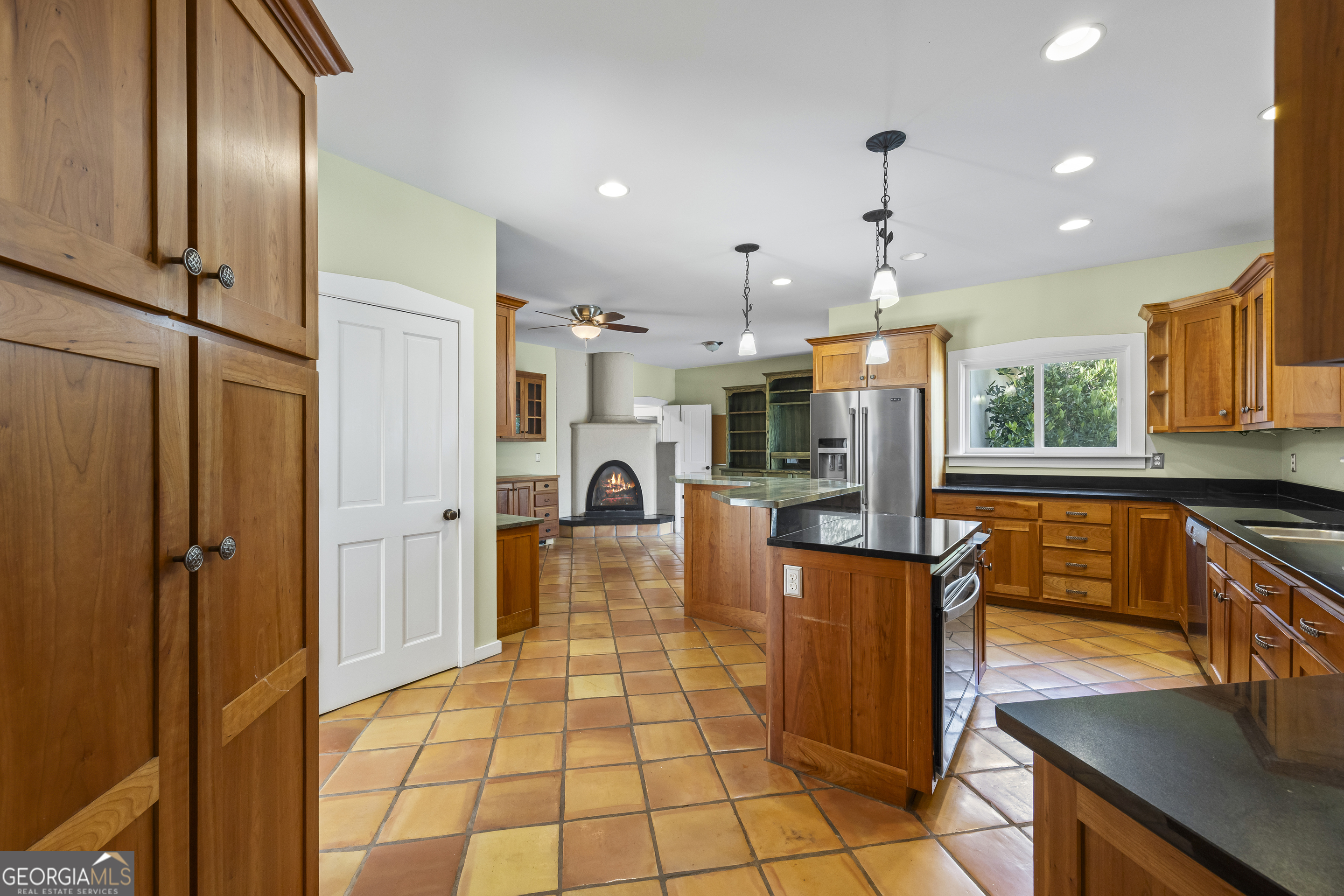 2223 Salem Road Watkinsville, GA 30677 - Photo 28 of 94 a large kitchen with stainless steel appliances kitchen island granite countertop a refrigerator a stove and a sink with wooden floor