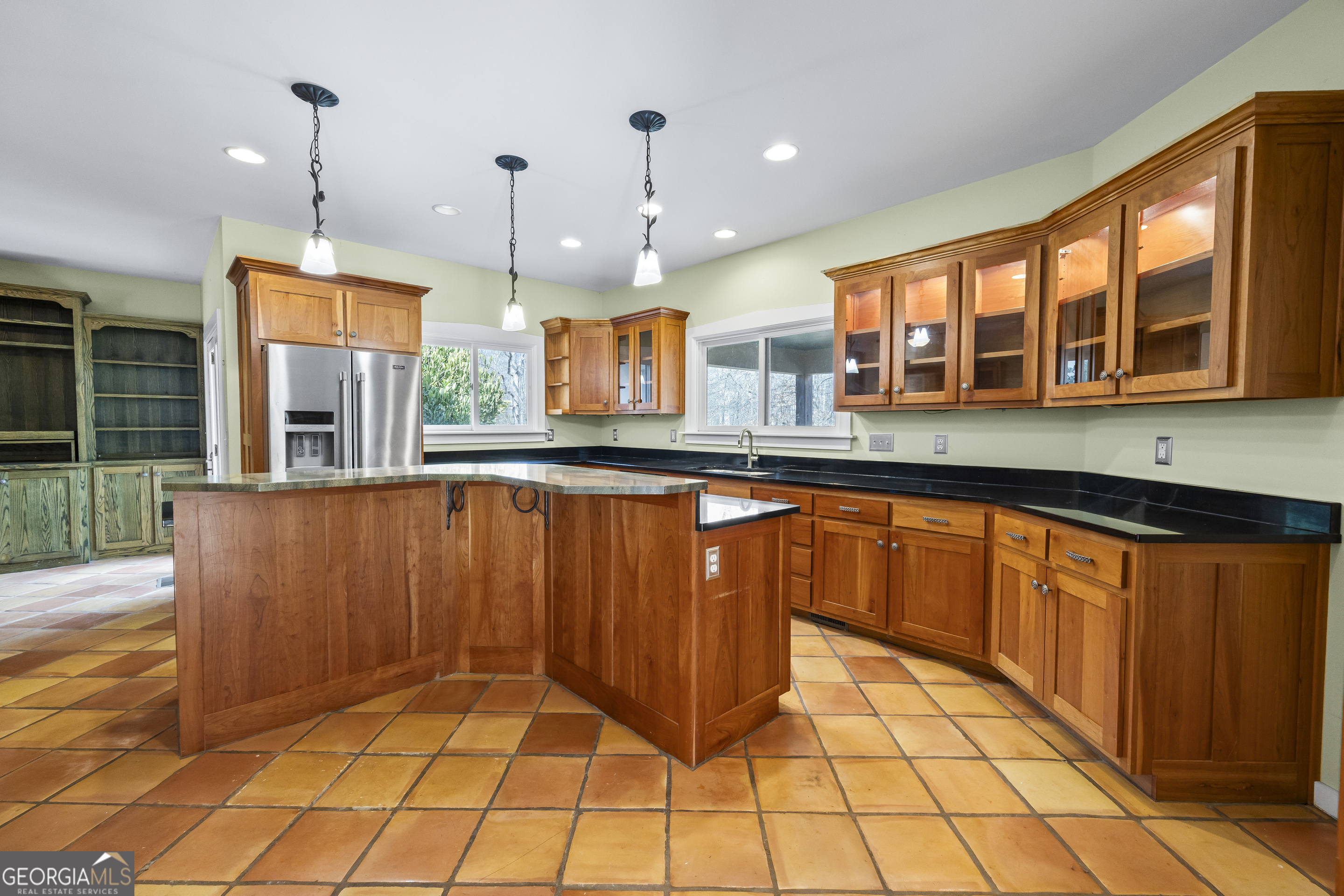 2223 Salem Road Watkinsville, GA 30677 - Photo 29 of 94 a large kitchen with granite countertop a stove a sink and dishwasher wooden cabinets with granite countertops