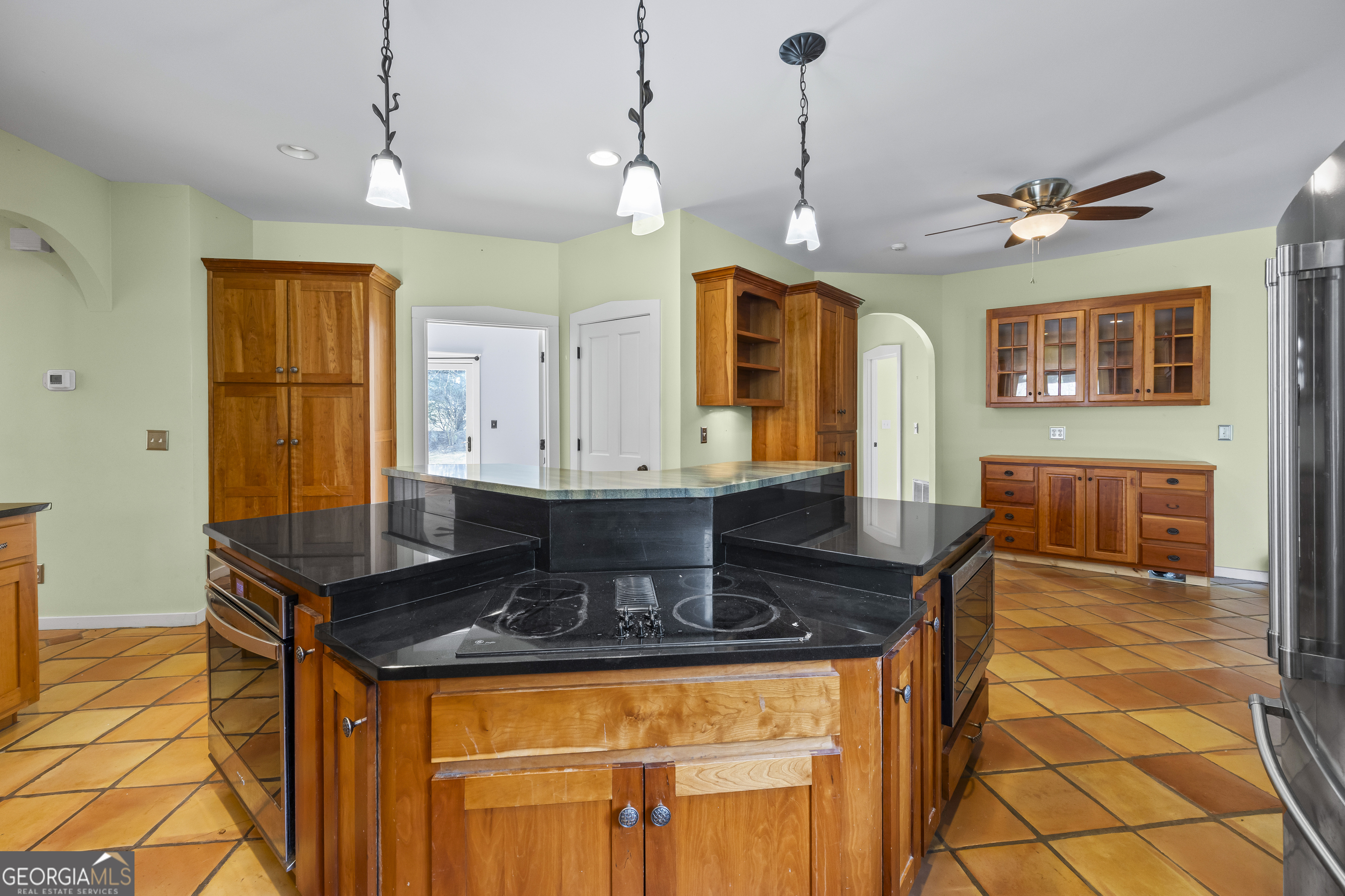2223 Salem Road Watkinsville, GA 30677 - Photo 32 of 94 a kitchen with stainless steel appliances granite countertop a stove a refrigerator a sink dishwasher a dining table and chairs with wooden floor