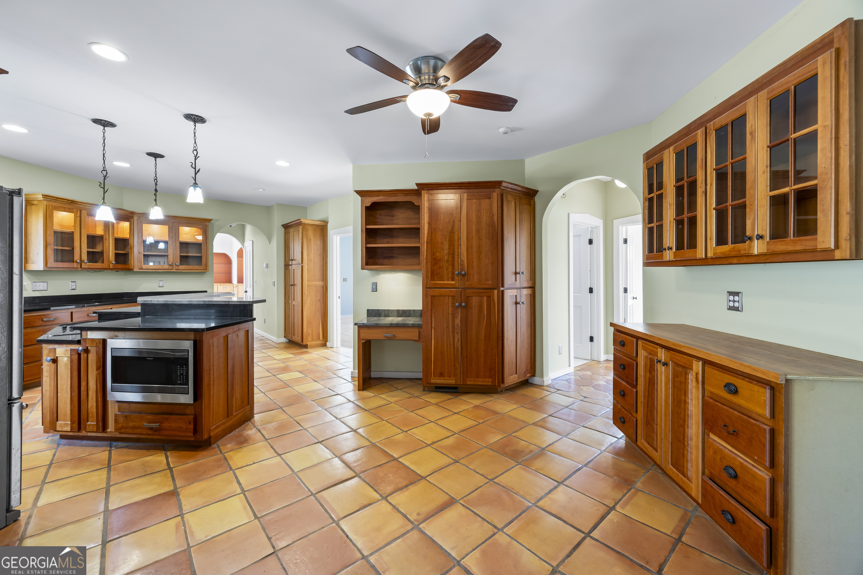 2223 Salem Road Watkinsville, GA 30677 - Photo 35 of 94 a kitchen with stainless steel appliances kitchen island granite countertop a refrigerator and a stove top oven