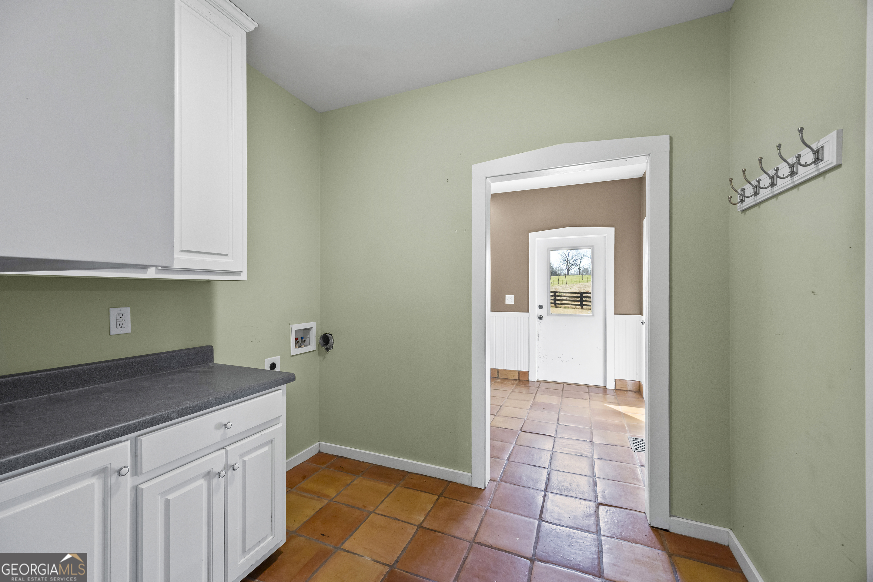 2223 Salem Road Watkinsville, GA 30677 - Photo 40 of 94 a kitchen with granite countertop a white cabinets and a sink