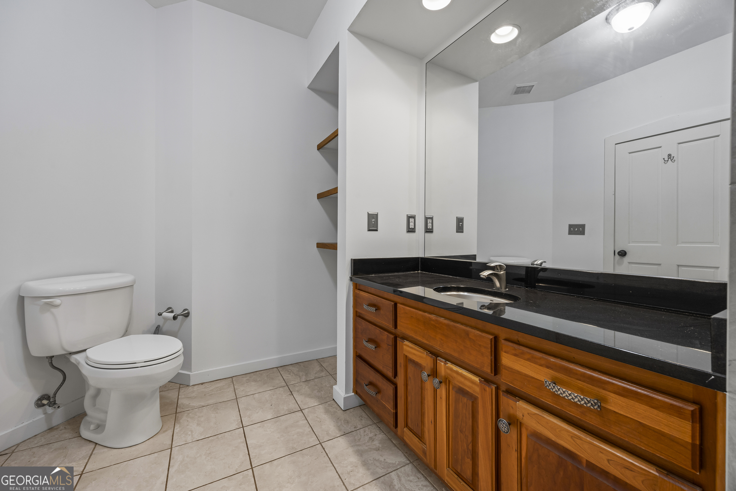 2223 Salem Road Watkinsville, GA 30677 - Photo 49 of 94 a bathroom with a sink a toilet and a mirror