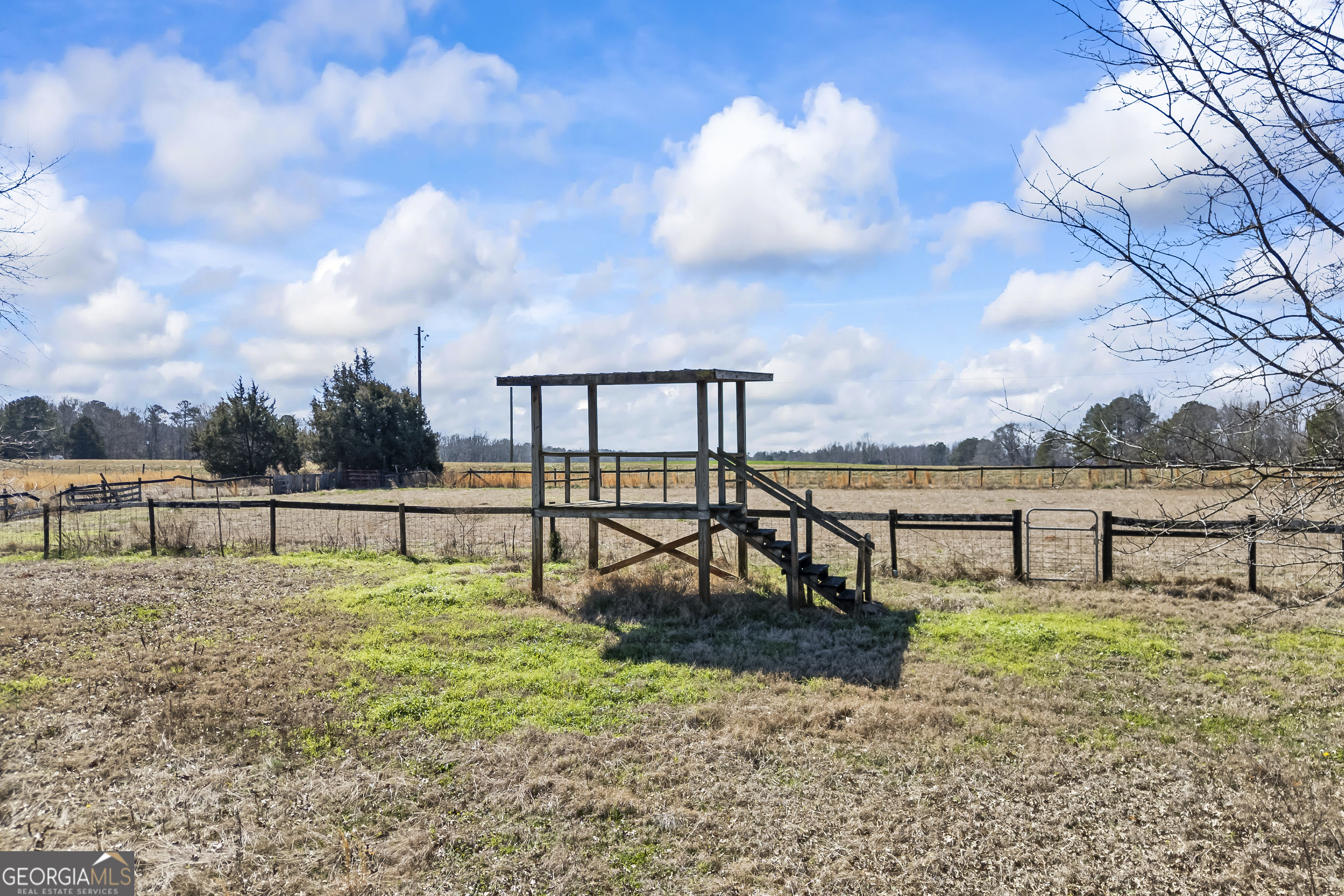 2223 Salem Road Watkinsville, GA 30677 - Photo 64 of 94 a view of a lake with a bench in roof