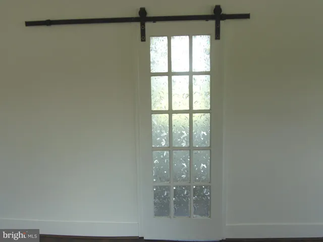 a view of a room with a large window