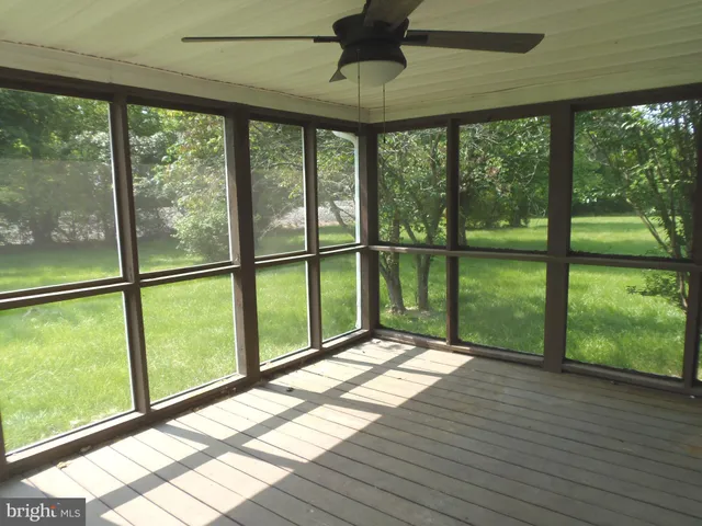 a view of porch with wooden floor and outdoor space