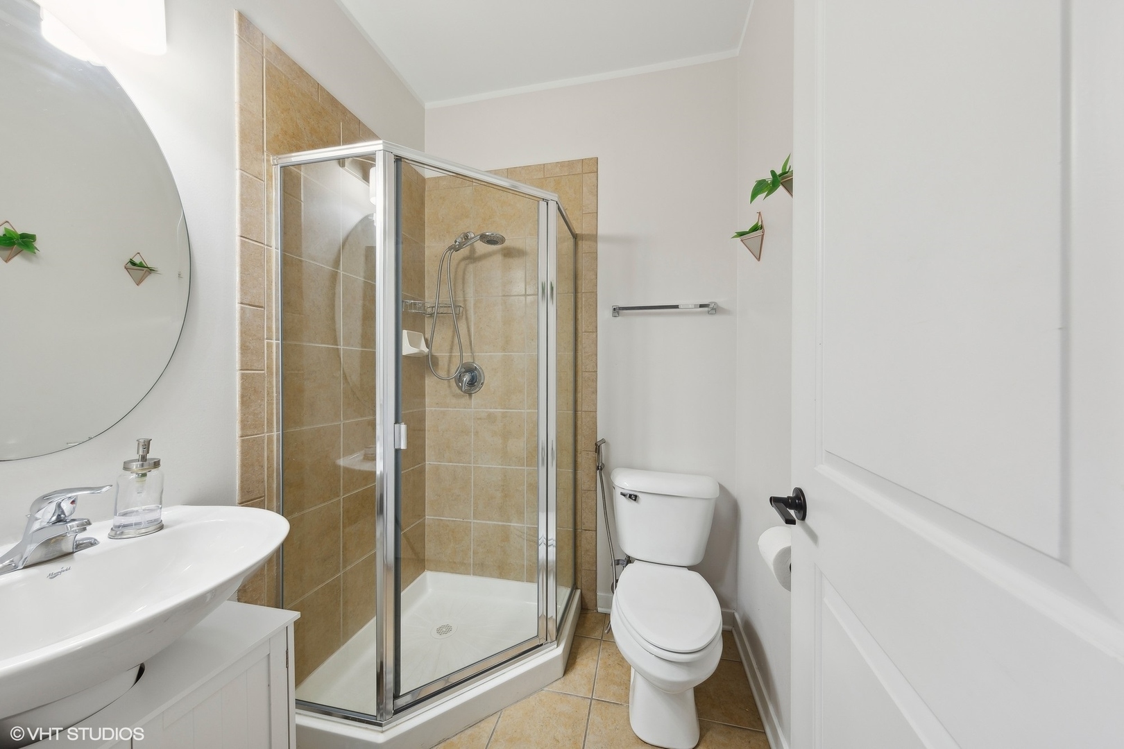 1244 West Monroe Street, Unit 6 Chicago, IL 60607 - Photo 15 of 21 a bathroom with a shower sink vanity mirror and toilet