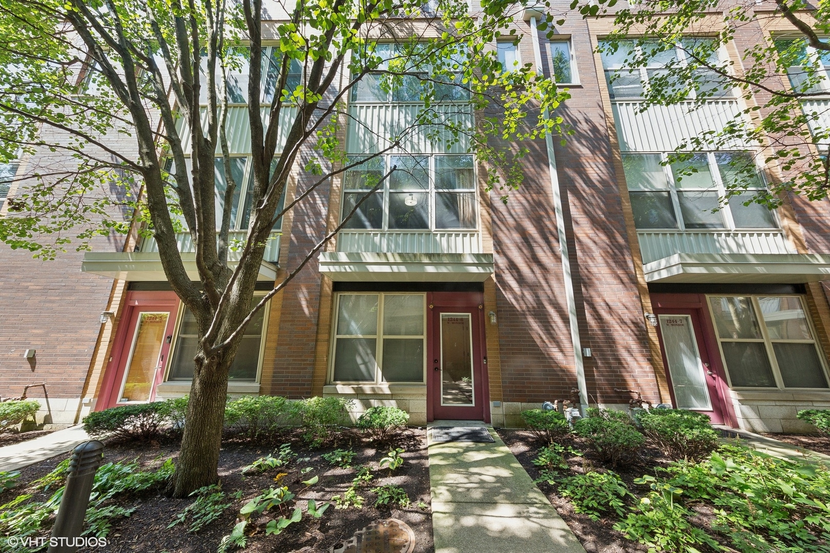 1244 West Monroe Street, Unit 6 Chicago, IL 60607 - Photo 2 of 21 a front view of a house with garden