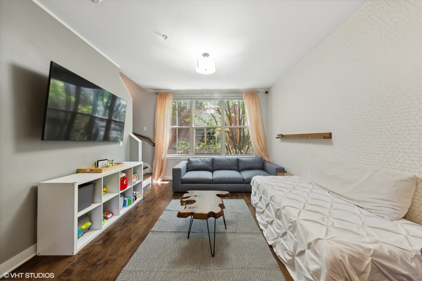 1244 West Monroe Street, Unit 6 Chicago, IL 60607 - Photo 5 of 21 a bedroom with furniture and a flat screen tv