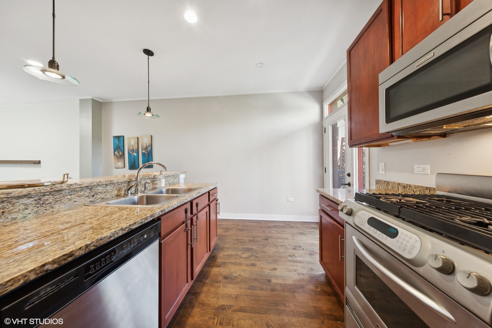 1244 West Monroe Street, Unit 6 Chicago, IL 60607 - Photo 7 of 21 a kitchen with a stove and a sink