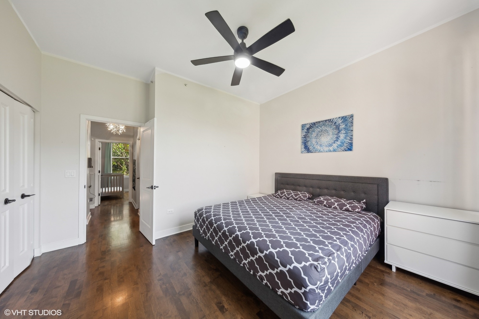 1244 West Monroe Street, Unit 6 Chicago, IL 60607 - Photo 9 of 21 a bedroom with a bed and a ceiling fan