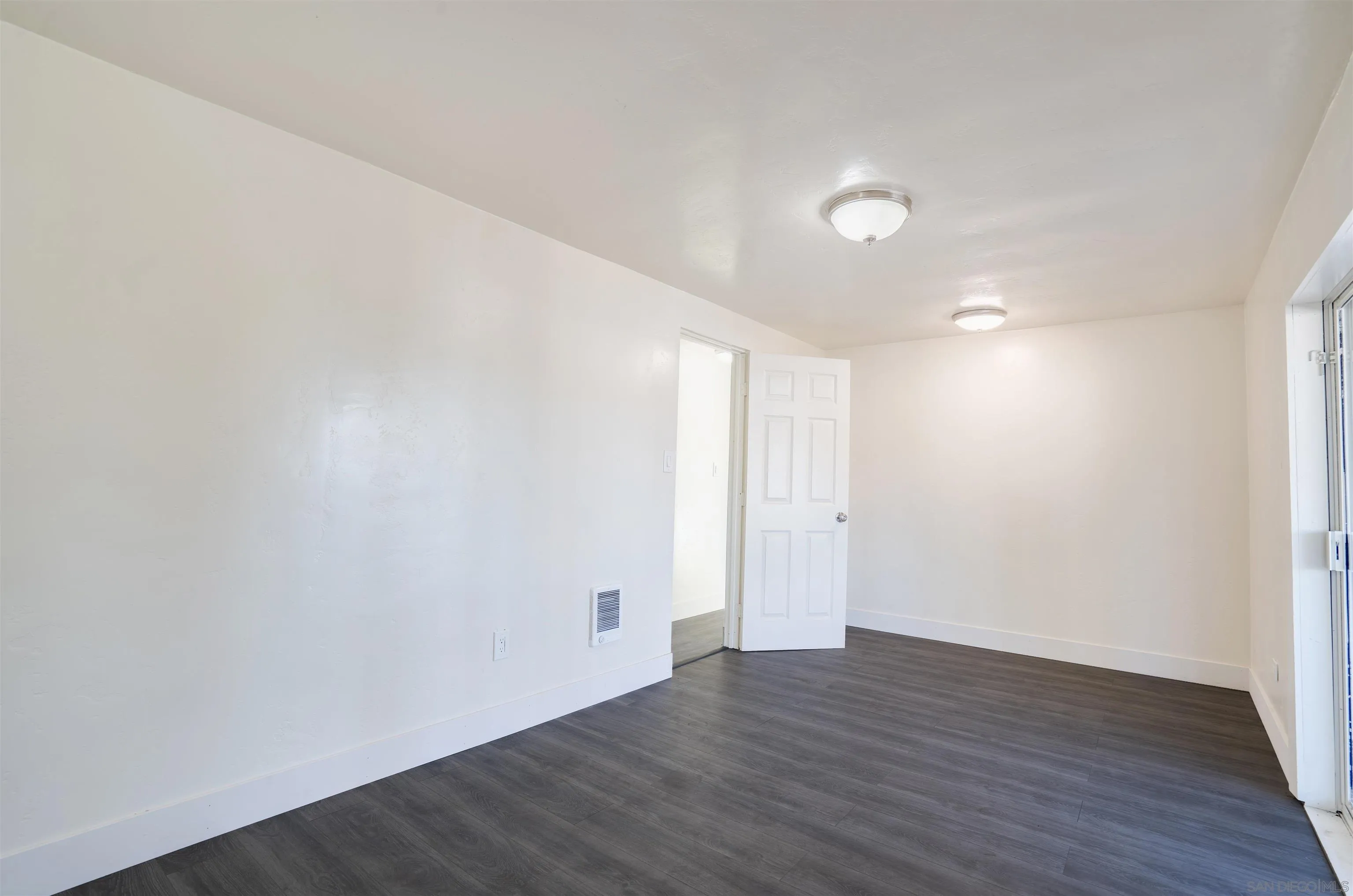 13490 Highway 8 Business, Unit SPC 14 Lakeside, CA 92040 - Photo 13 of 25 a view of an empty room with wooden floor