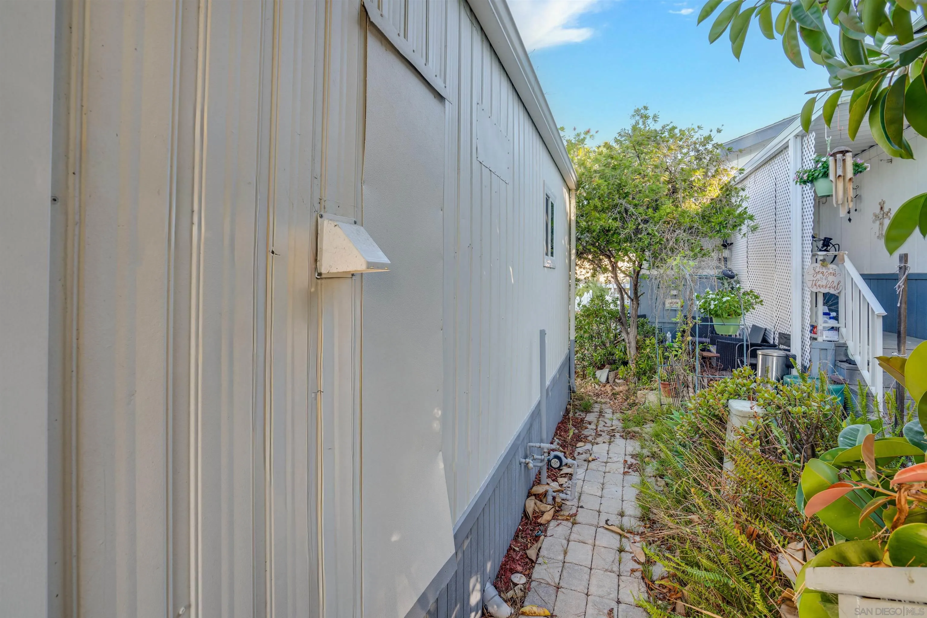 13490 Highway 8 Business, Unit SPC 14 Lakeside, CA 92040 - Photo 16 of 25 a view of a house with a backyard