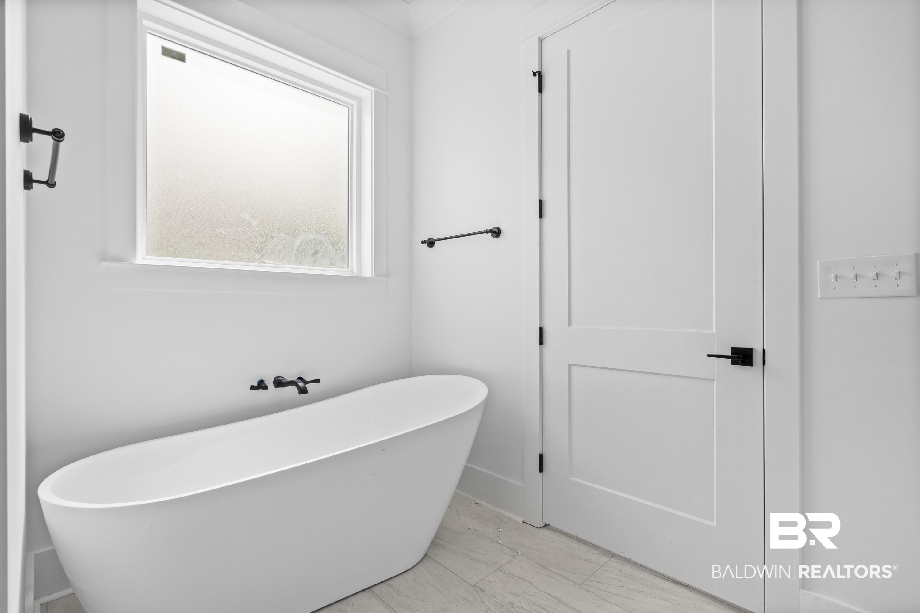 30650 Ono N Loop West Orange Beach, AL 36561 - Photo 20 of 38 Full bath with a soaking tub and marble finish flooring