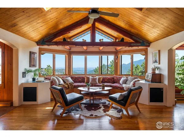 a view of a livingroom with furniture and a fireplace