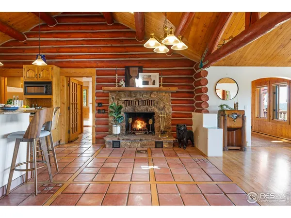 a living room with lots of furniture and wooden floors