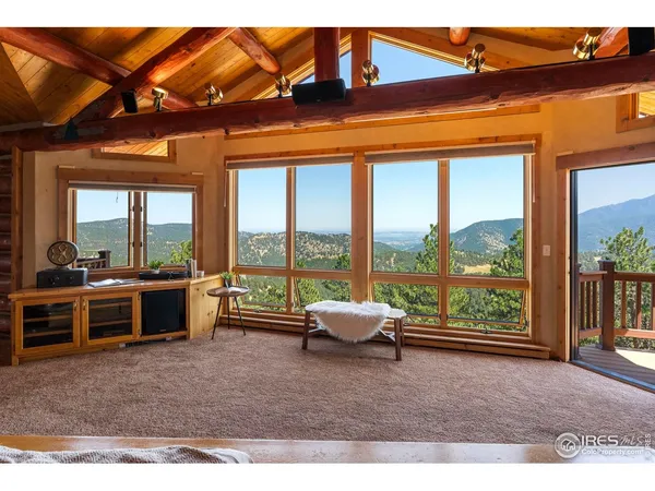 a view of a floor to ceiling window and a yard