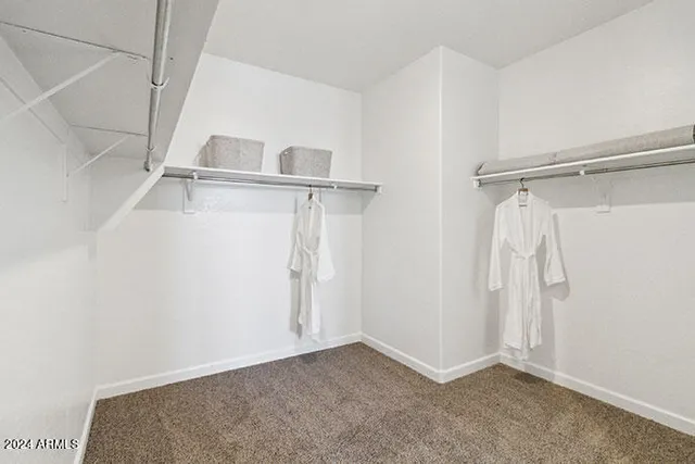 a kitchen with sink and cabinets