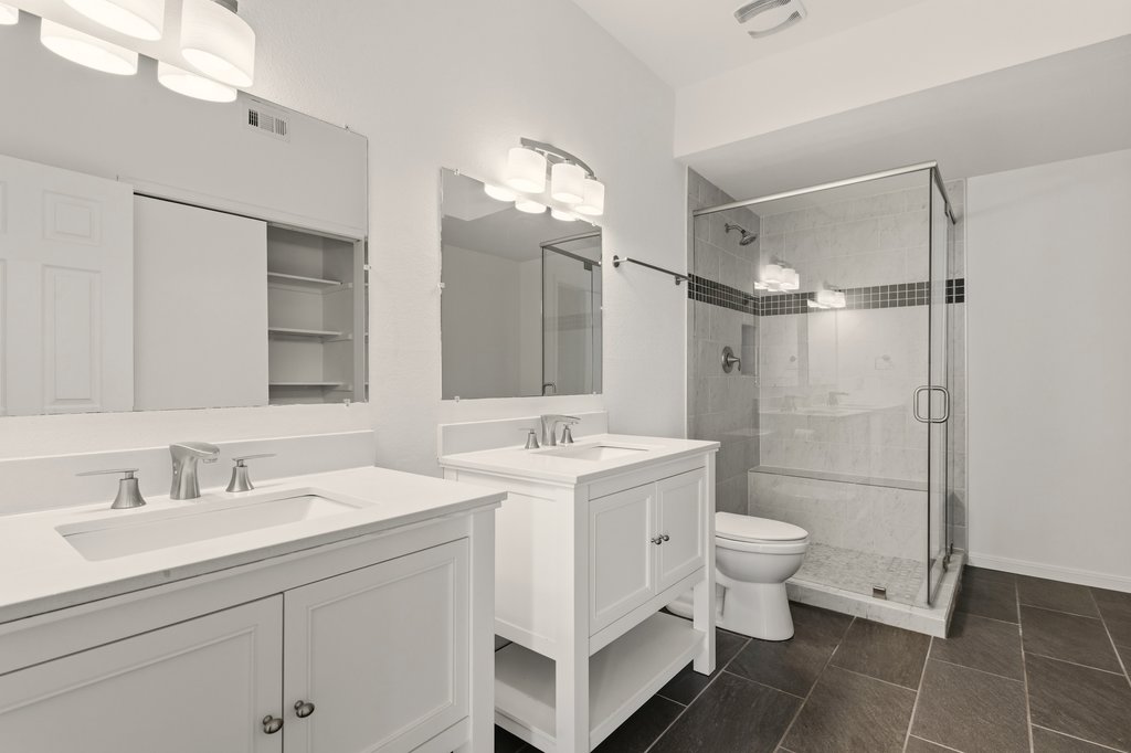 2450 Wickersham Lane, Unit 1006 Austin, TX 78741 - Photo 18 of 27 a bathroom with a sink toilet and shower