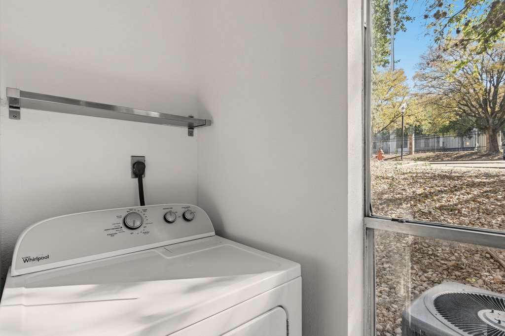 2450 Wickersham Lane, Unit 1006 Austin, TX 78741 - Photo 23 of 27 a bathroom with a sink and vanity