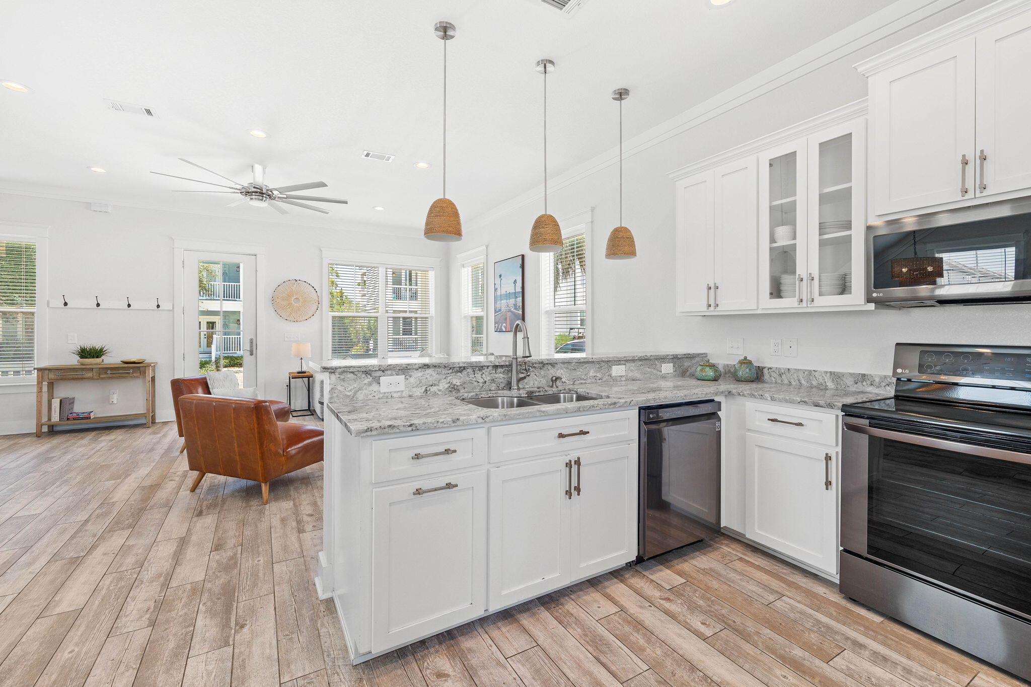 44 Abbey Road Santa Rosa Beach, FL 32459 - Photo 15 of 52 a kitchen with stainless steel appliances granite countertop a stove a sink and a wooden floors