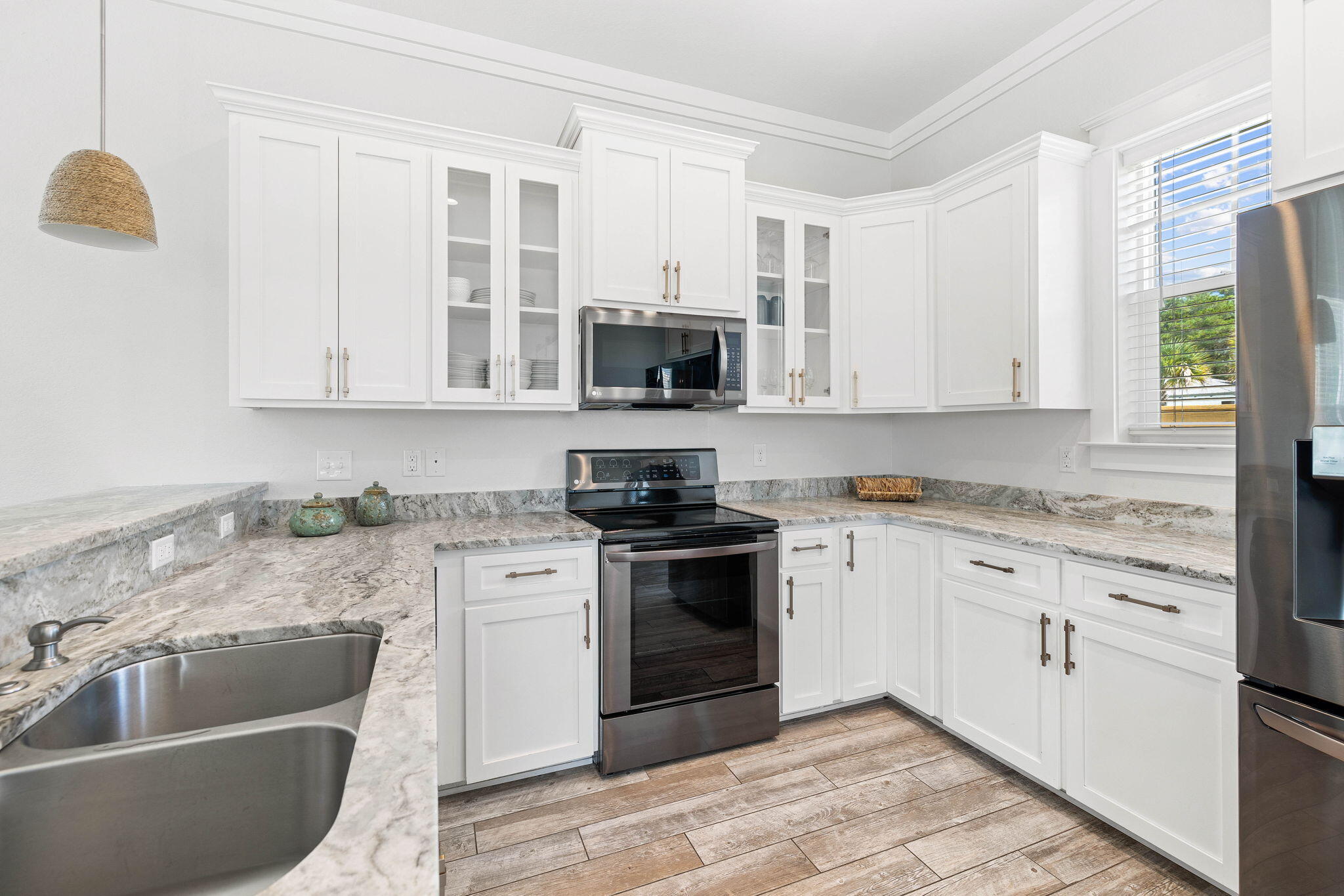 44 Abbey Road Santa Rosa Beach, FL 32459 - Photo 17 of 52 a kitchen with granite countertop a stove sink and microwave
