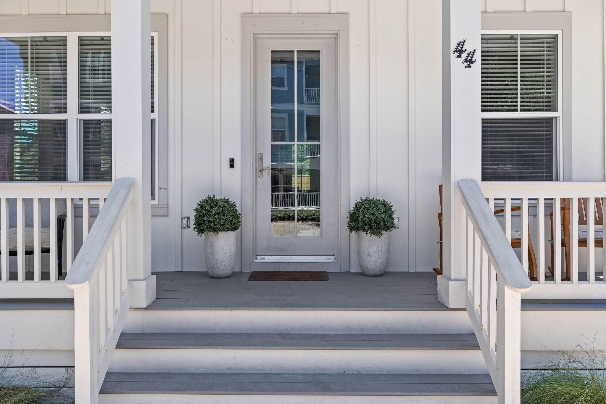 44 Abbey Road Santa Rosa Beach, FL 32459 - Photo 4 of 52 a view of staircase with wooden floor and a potted plant