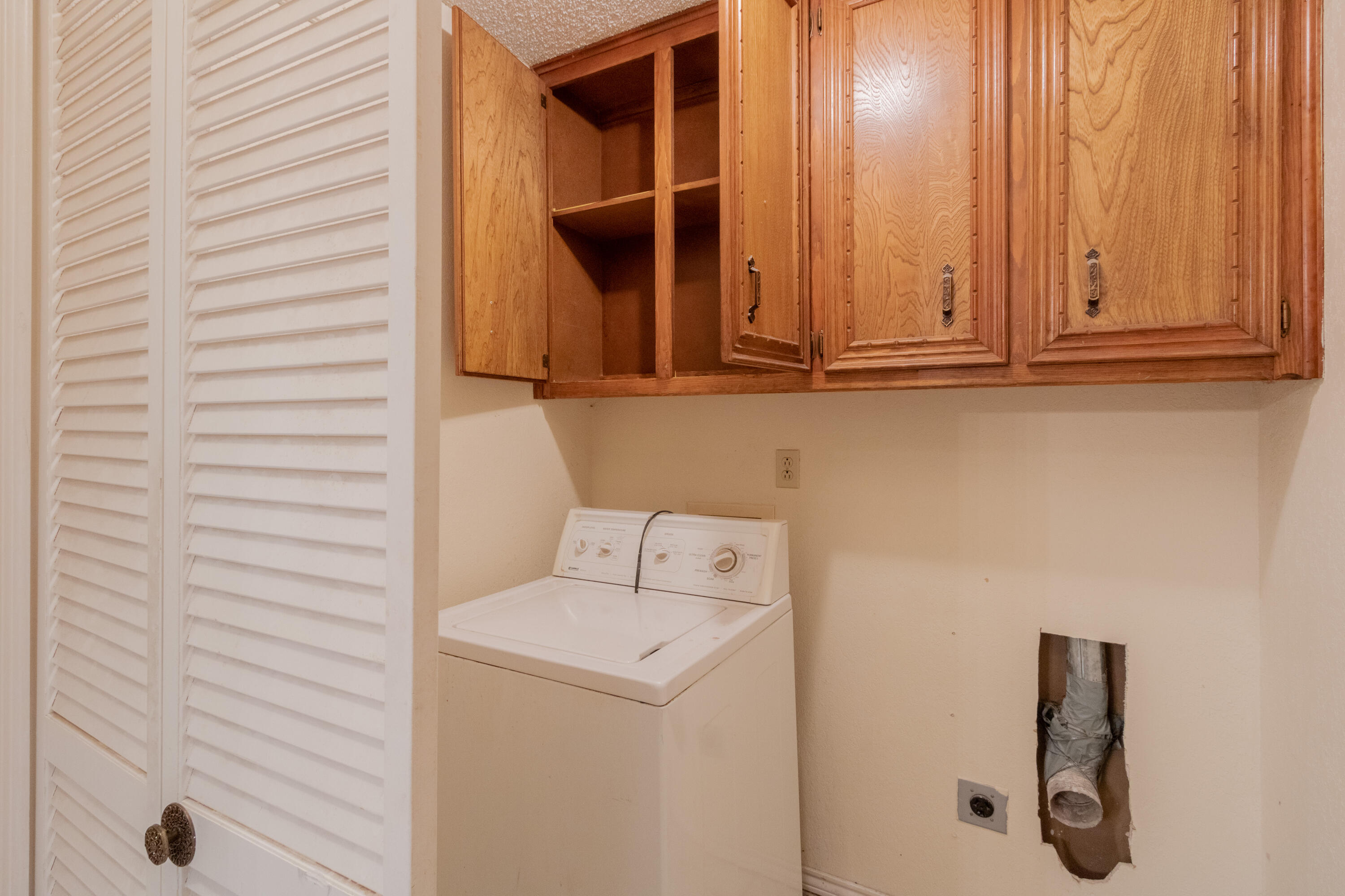 5714 73rd Street Lubbock, TX 79424 - Photo 14 of 38 a bathroom with a sink and a mirror
