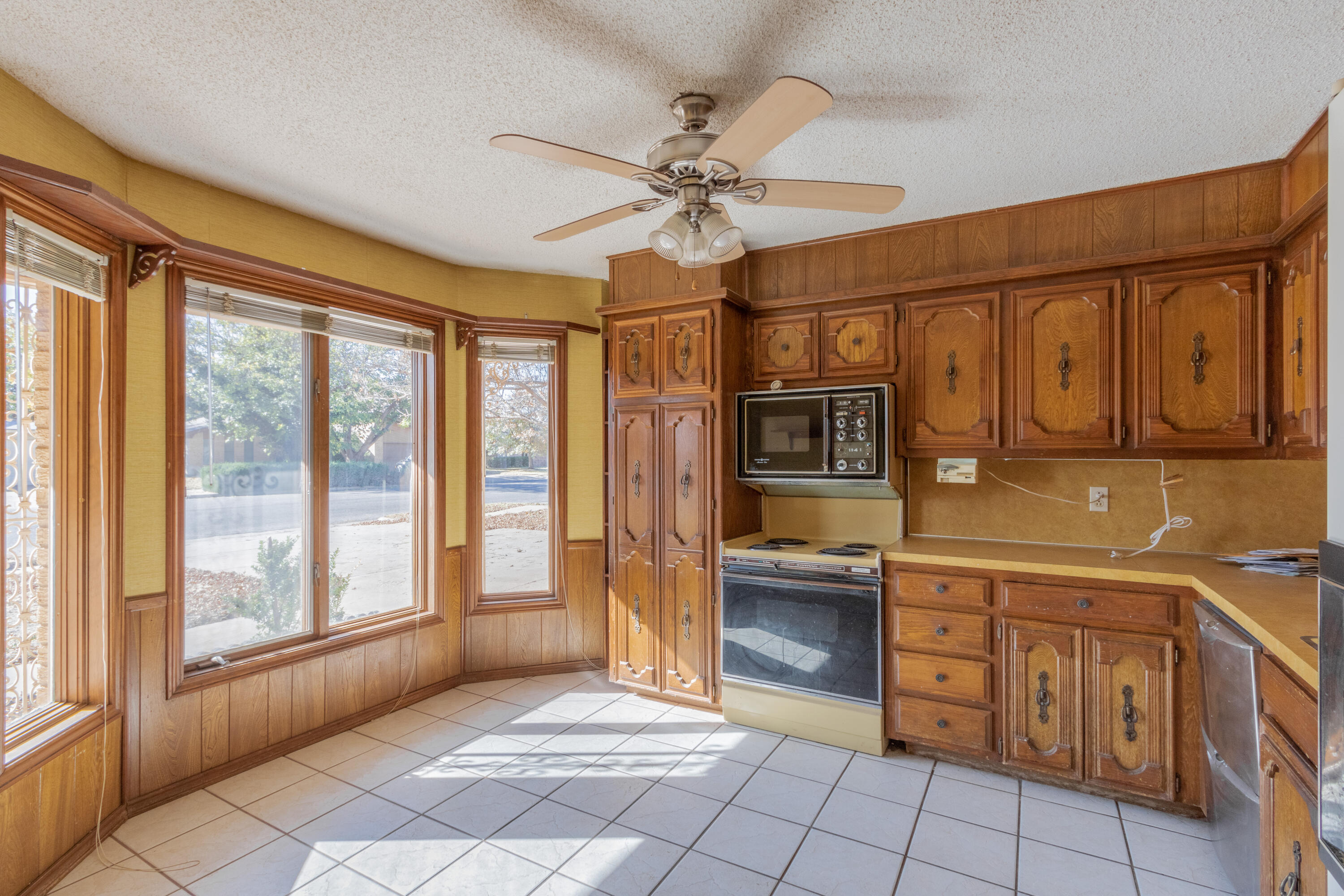 5714 73rd Street Lubbock, TX 79424 - Photo 2 of 38 a view of a kitchen with stainless steel appliances granite countertop a refrigerator and cabinets