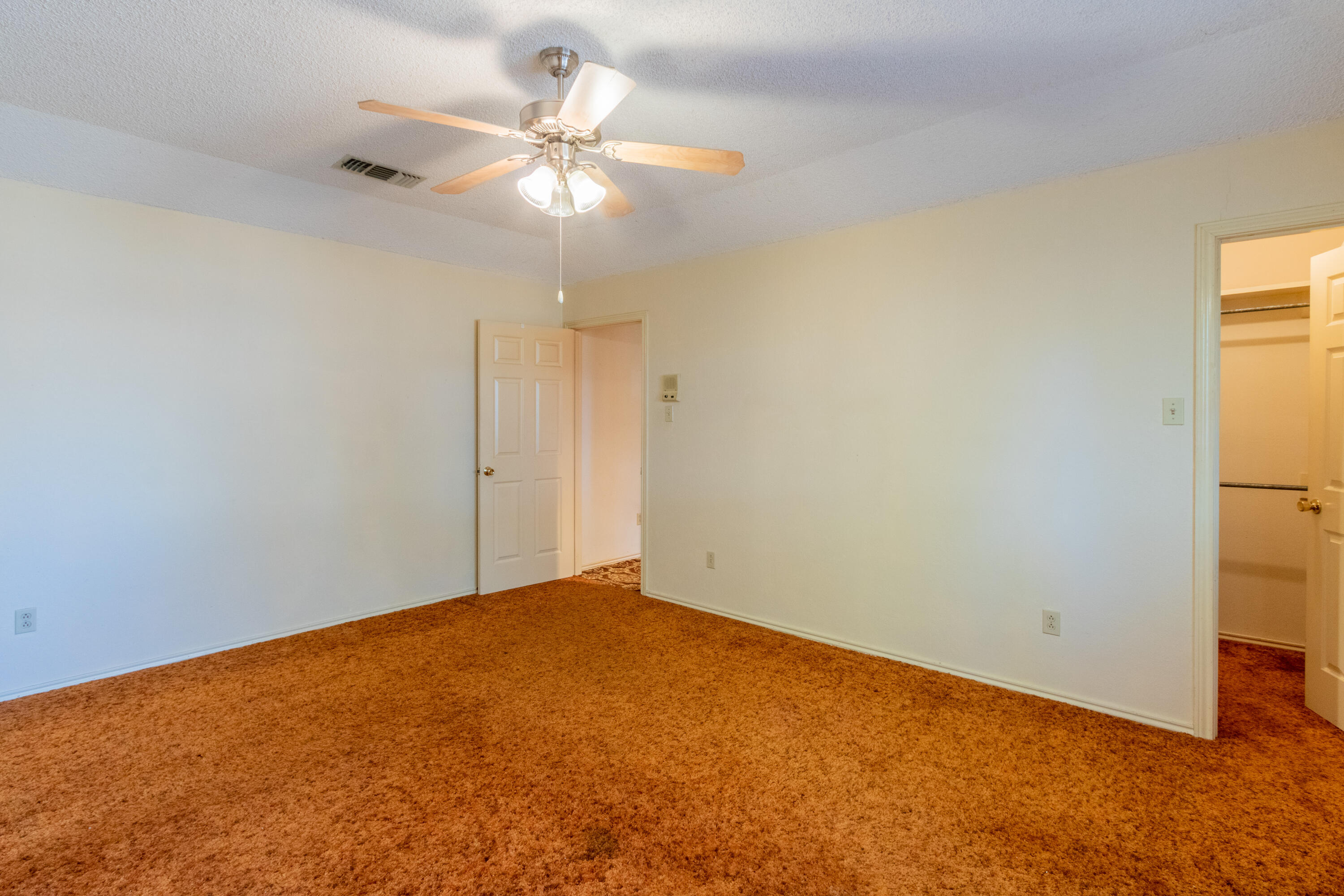 5714 73rd Street Lubbock, TX 79424 - Photo 26 of 38 an empty room with a ceiling fan and a window
