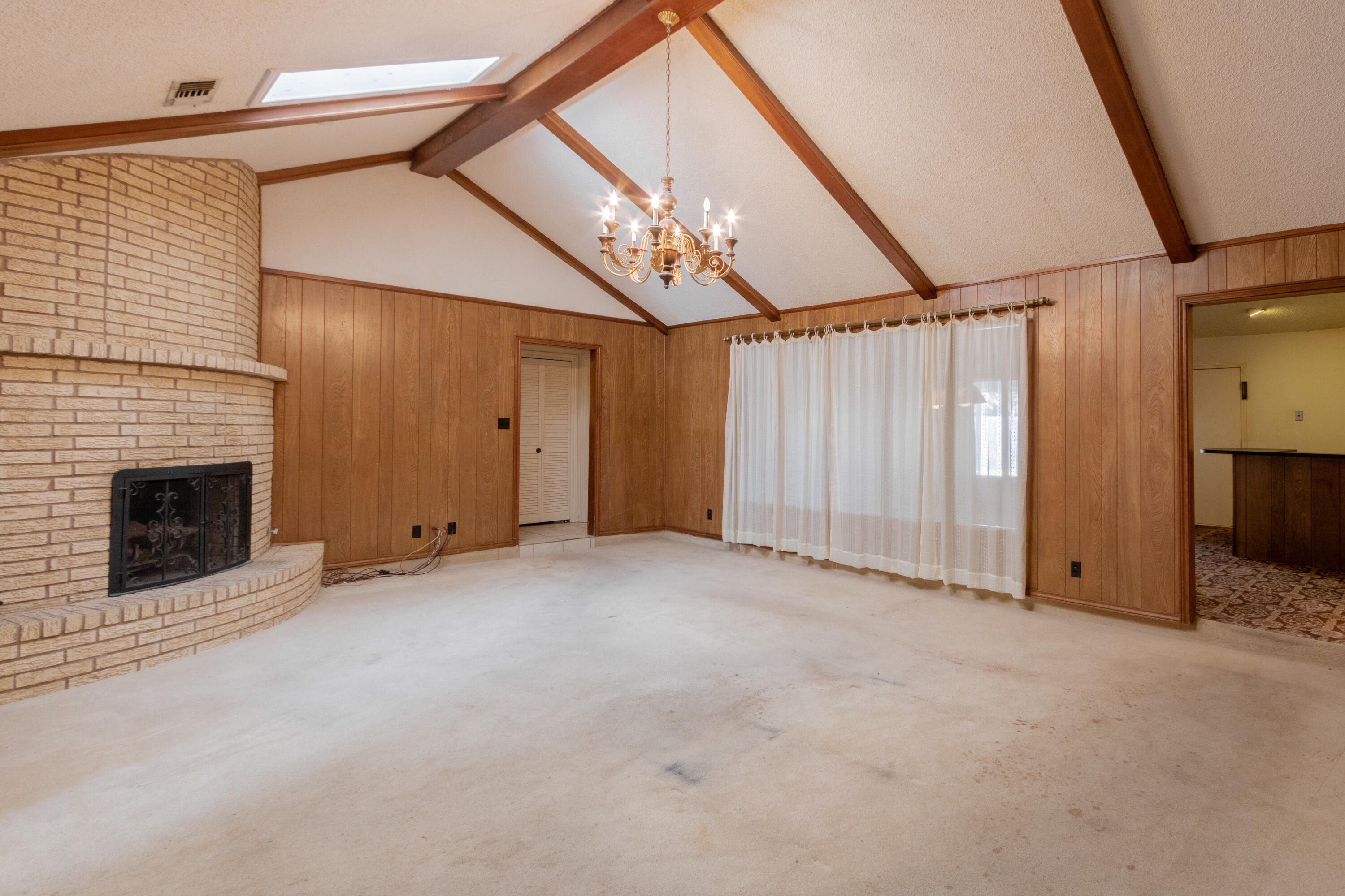 5714 73rd Street Lubbock, TX 79424 - Photo 3 of 38 a view of an empty room with a fireplace