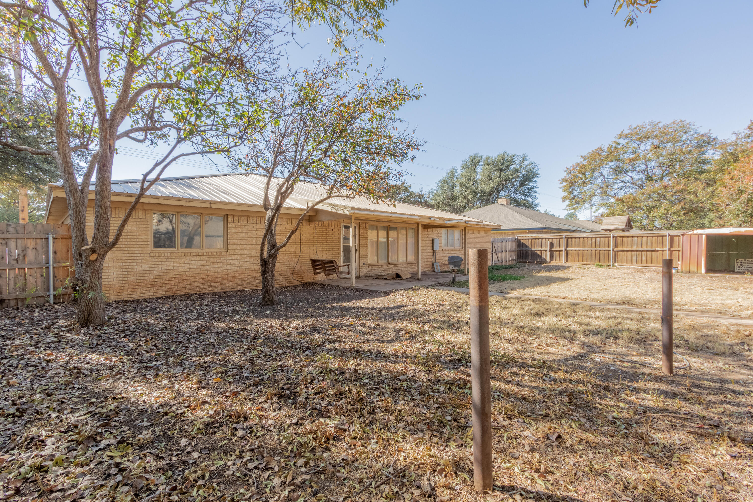 5714 73rd Street Lubbock, TX 79424 - Photo 36 of 38 a view of a house with a yard