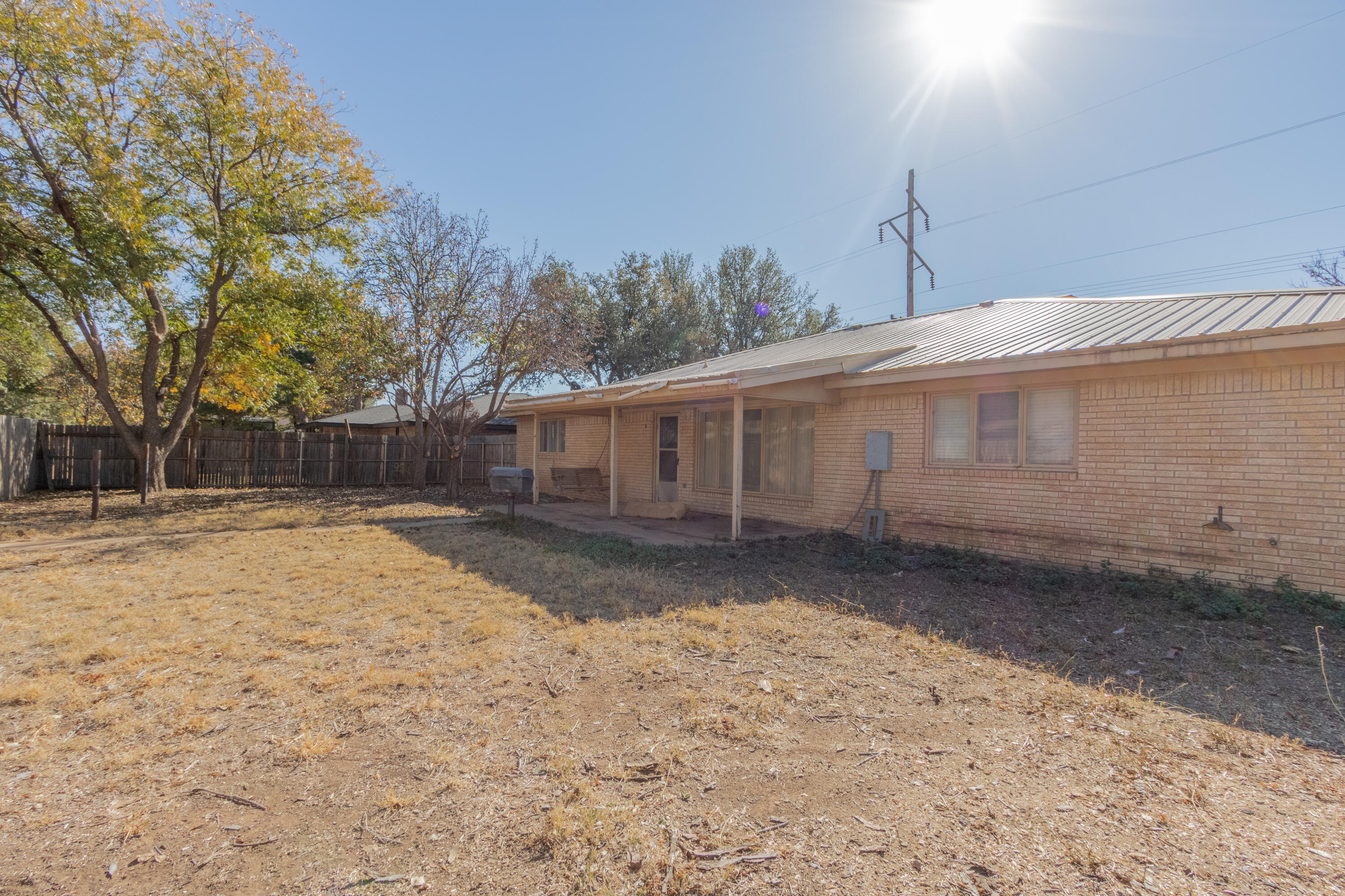 5714 73rd Street Lubbock, TX 79424 - Photo 37 of 38 a view of a house with a yard