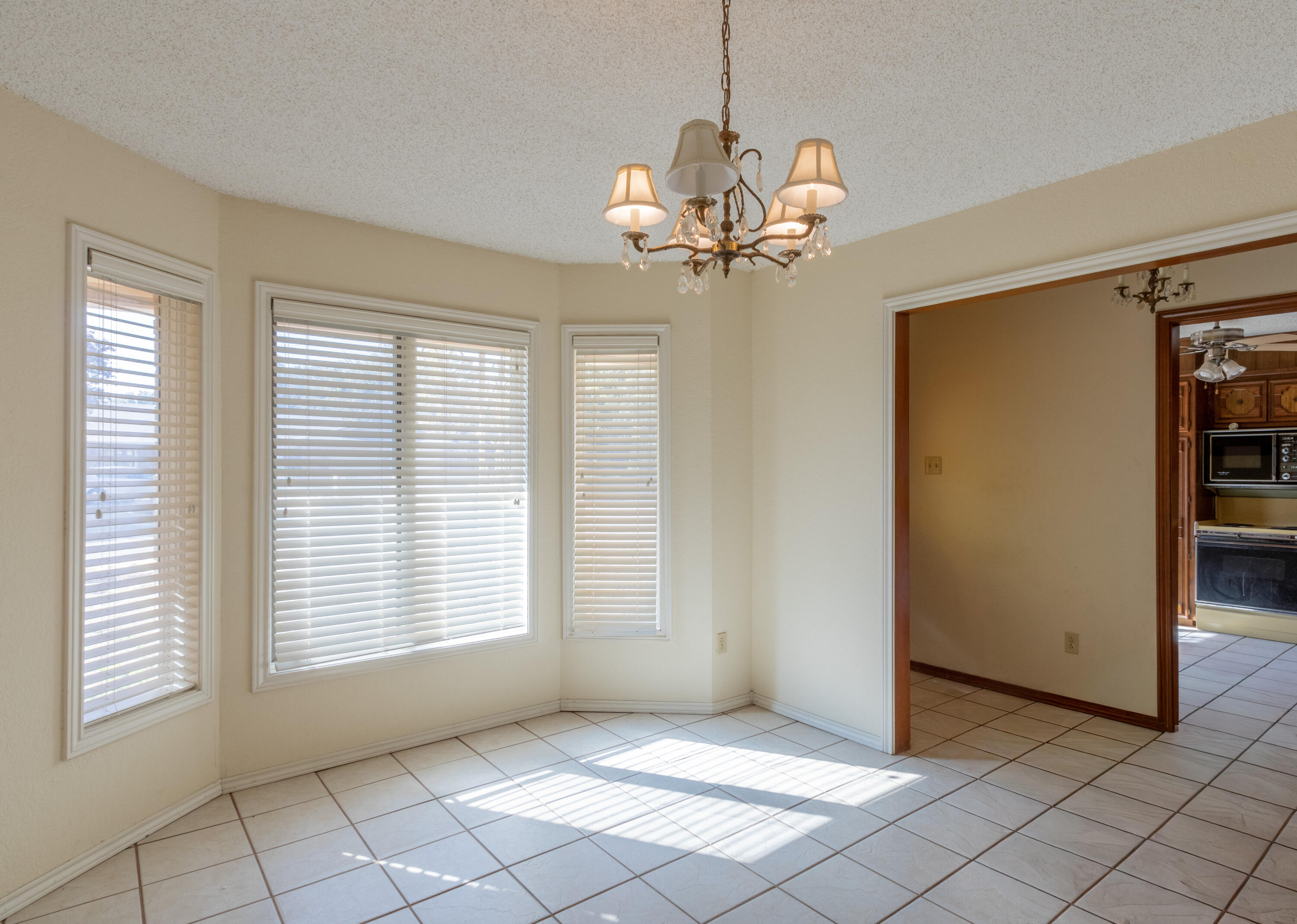 5714 73rd Street Lubbock, TX 79424 - Photo 4 of 38 a view of an empty room with a window