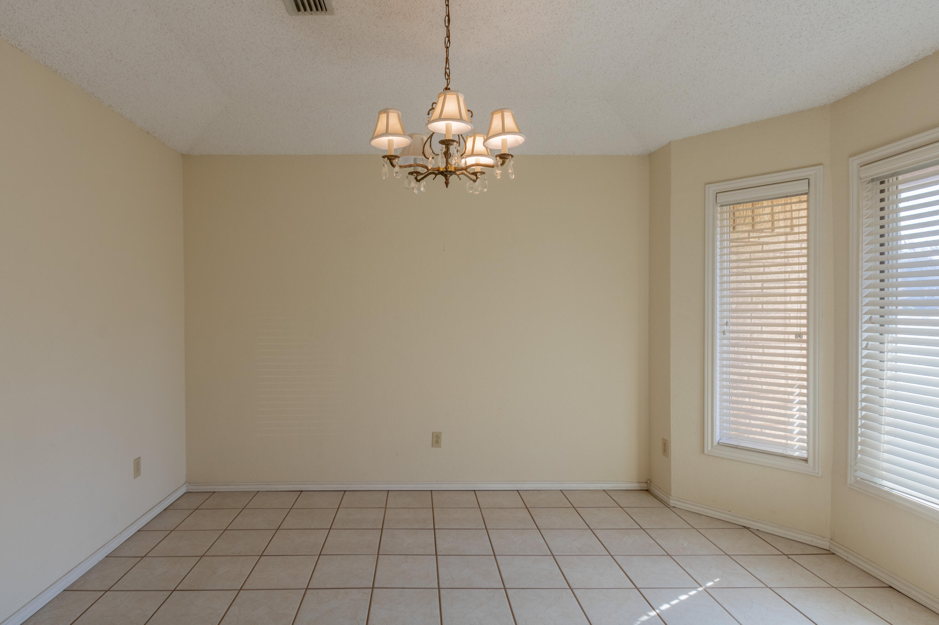 5714 73rd Street Lubbock, TX 79424 - Photo 8 of 38 a view of a chandelier in a room