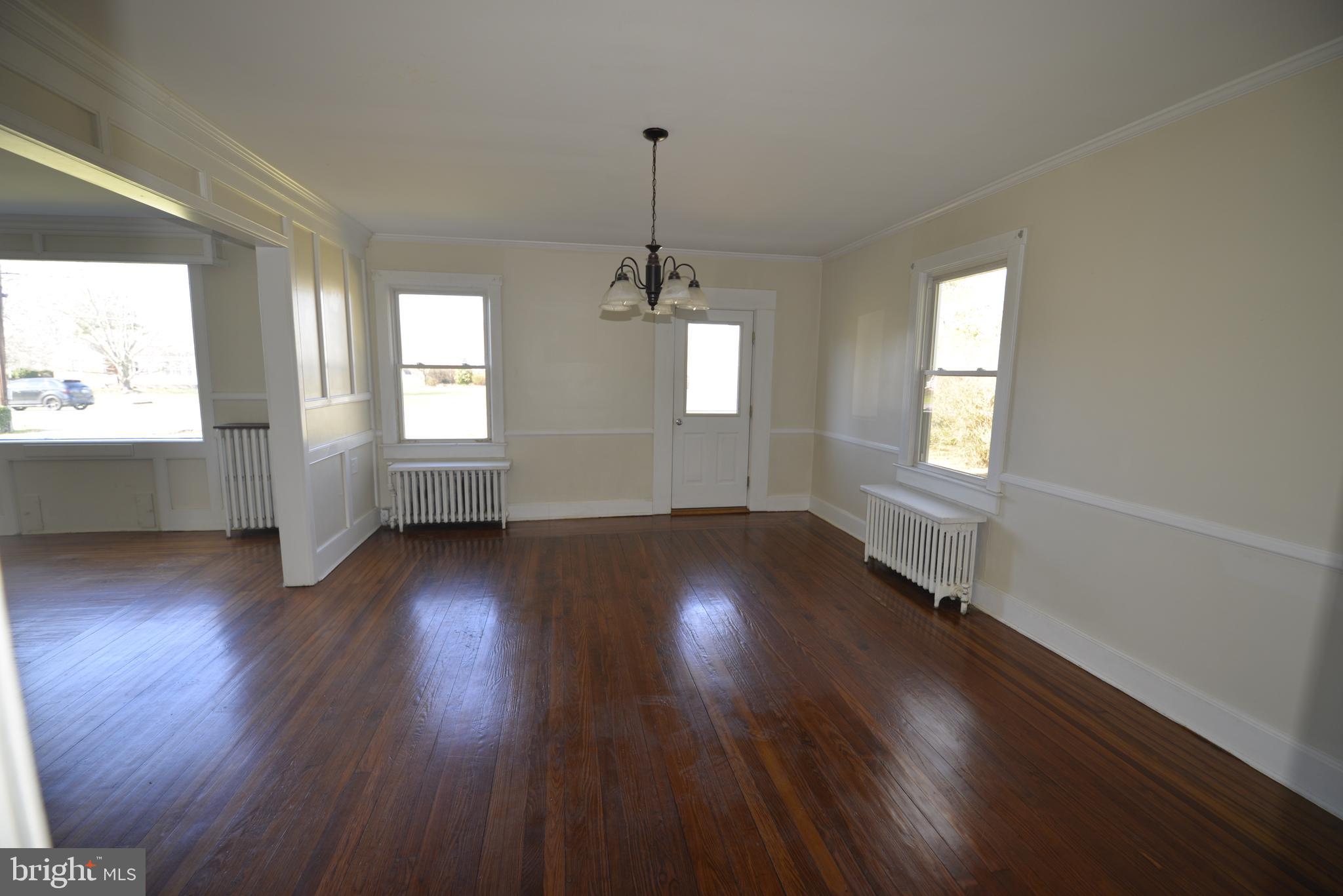 720 Church Hill Road Centreville, MD 21617 - Photo 15 of 16 an empty room with wooden floor and windows