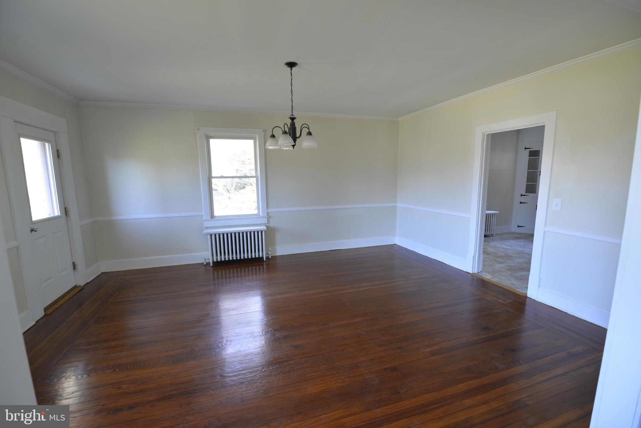 720 Church Hill Road Centreville, MD 21617 - Photo 16 of 16 an empty room with wooden floor and windows