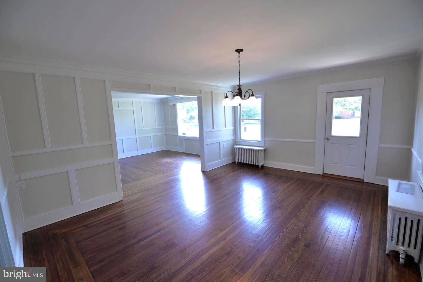 720 Church Hill Road Centreville, MD 21617 - Photo 5 of 16 a view of empty room with wooden floor and window