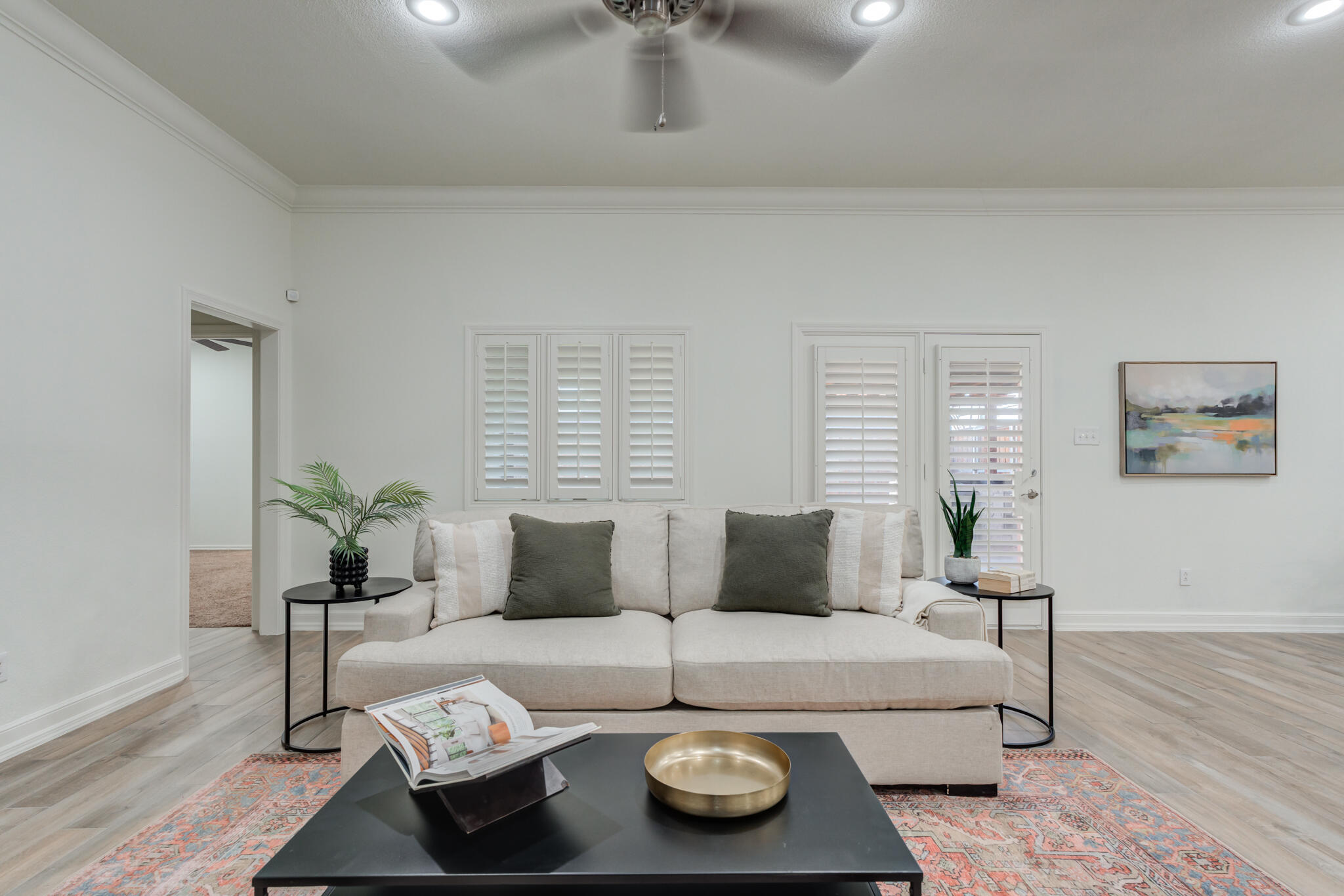 4707 85th Street Lubbock, TX 79424 - Photo 14 of 63 a living room with furniture and wooden floor