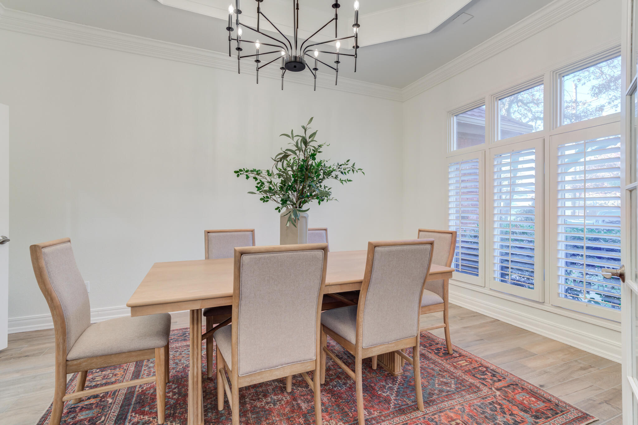 4707 85th Street Lubbock, TX 79424 - Photo 16 of 63 a view of a dining room with furniture and wooden floor