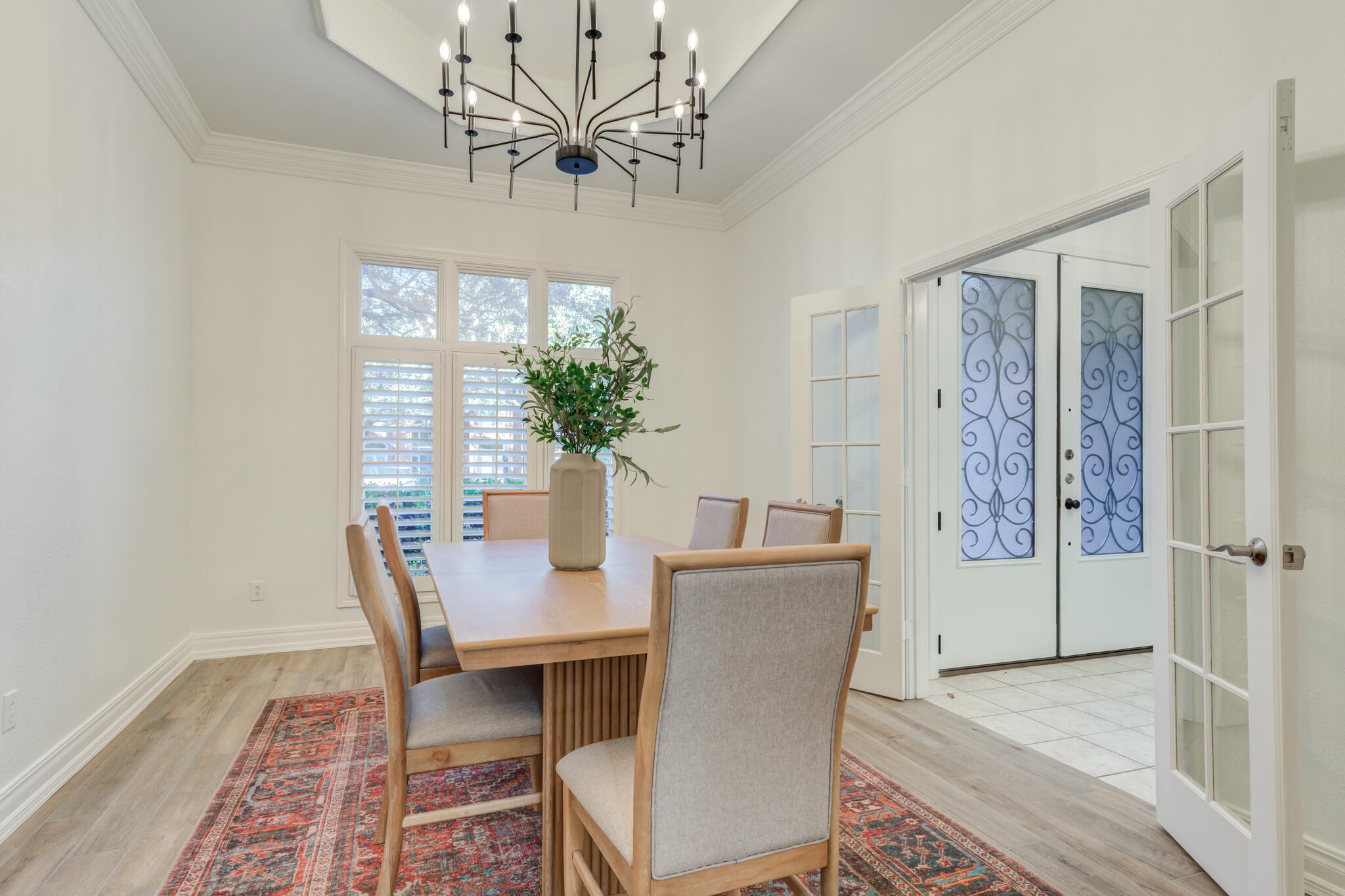 4707 85th Street Lubbock, TX 79424 - Photo 17 of 63 a view of a dining room with furniture window and wooden floor